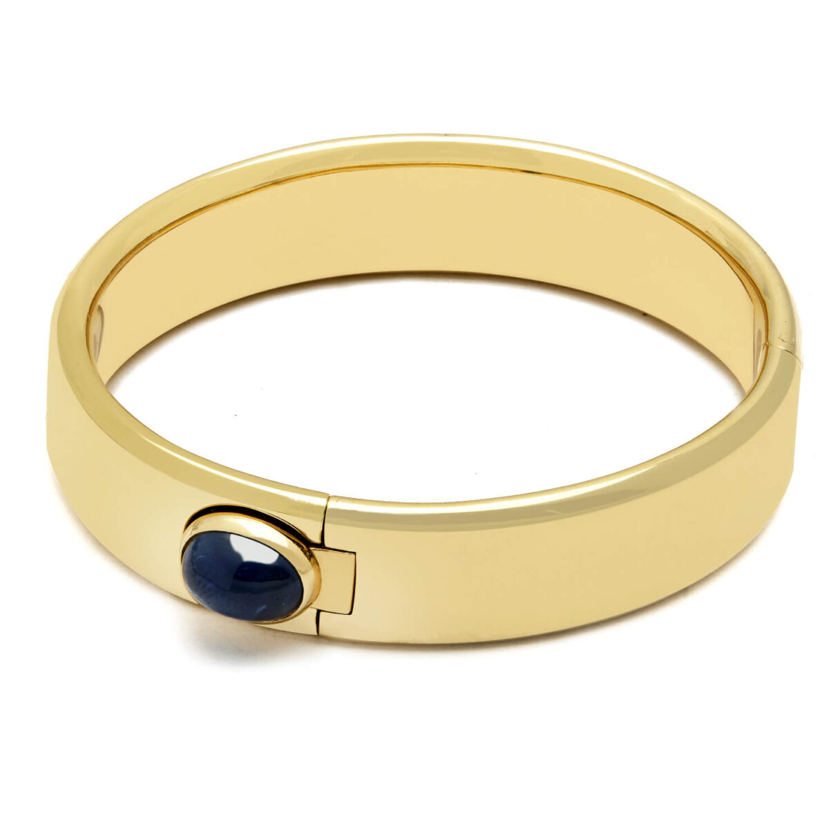 Bracciale Pomellato rigido in oro giallo con zaffiro cabochon laterale