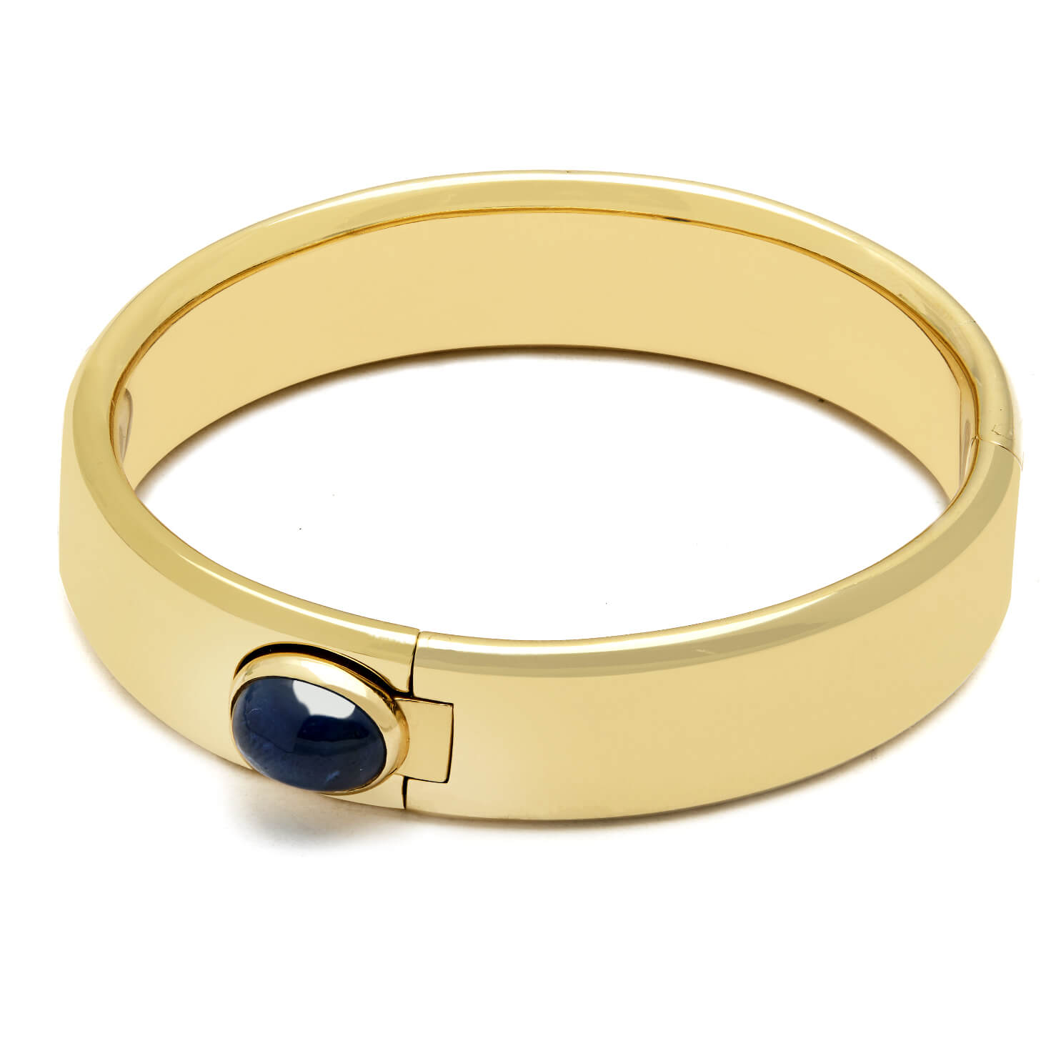 Bracciale Pomellato rigido in oro giallo con zaffiro cabochon laterale
